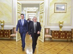 Russian President Vladimir Putin (R) and Syrian President Bashar al-Assad enter a hall during a meeting at the Kremlin in Moscow, Russia, October 20, 2015. Assad made a surprise visit to Moscow on Tuesday evening to thank Putin for launching air strikes against Islamist militants in Syria. Picture taken October 20, 2015. REUTERS/Alexei Druzhinin/RIA Novosti/Kremlin ATTENTION EDITORS - THIS IMAGE HAS BEEN SUPPLIED BY A THIRD PARTY. IT IS DISTRIBUTED, EXACTLY AS RECEIVED BY REUTERS, AS A SERVICE TO CLIENTS. - RTS5E2Z