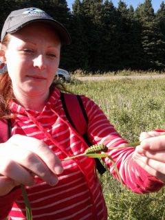 Sara Collins holding a caterpillar