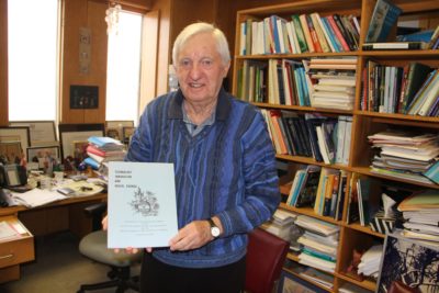 Professor Fraser Taylor proudly shows off the 1984 proceedings booklet from Technology Innovation and Social Change (2015)