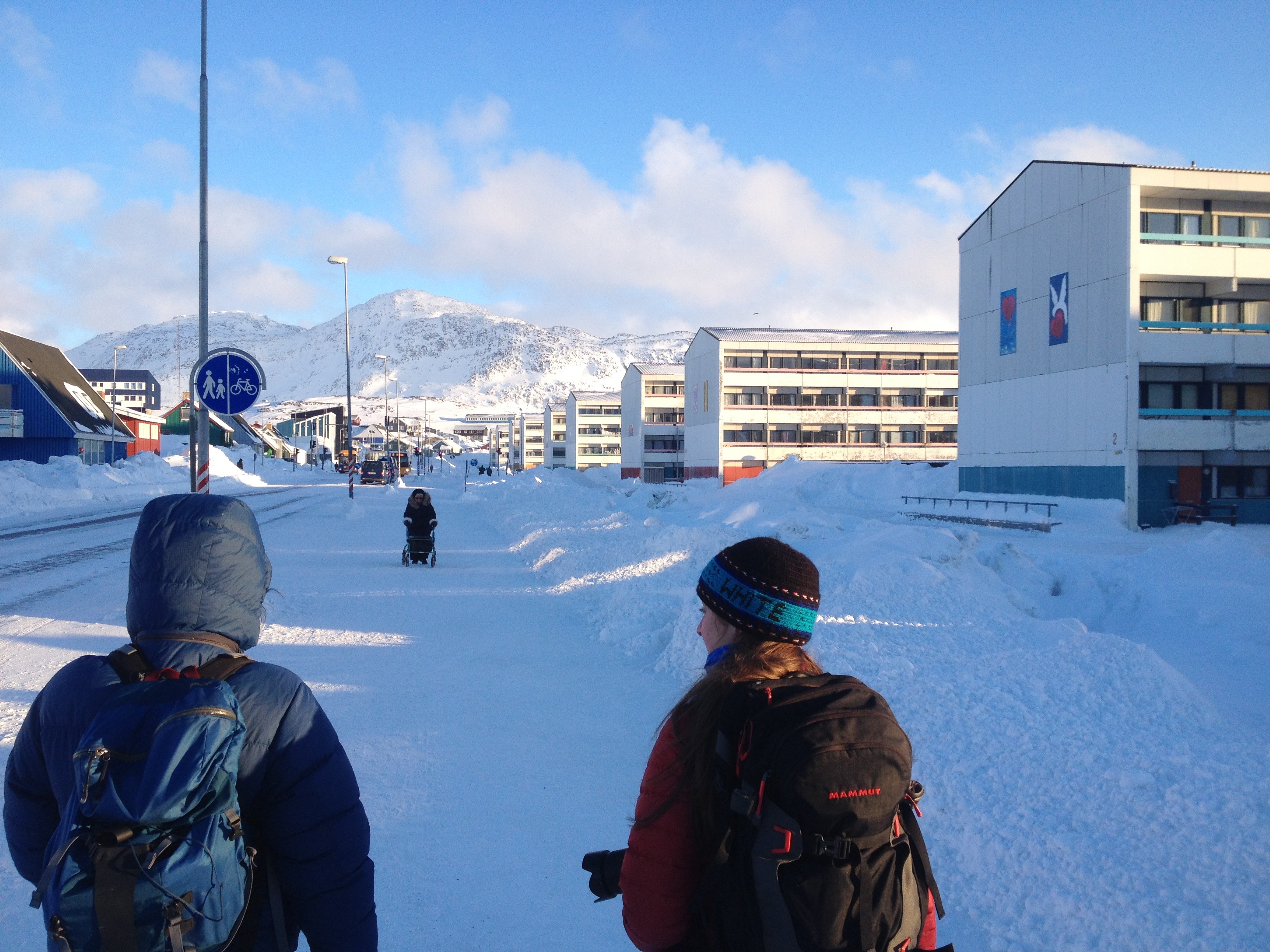 Walking through the streets of Nuuk. The large buildings to the right are residential complexes.