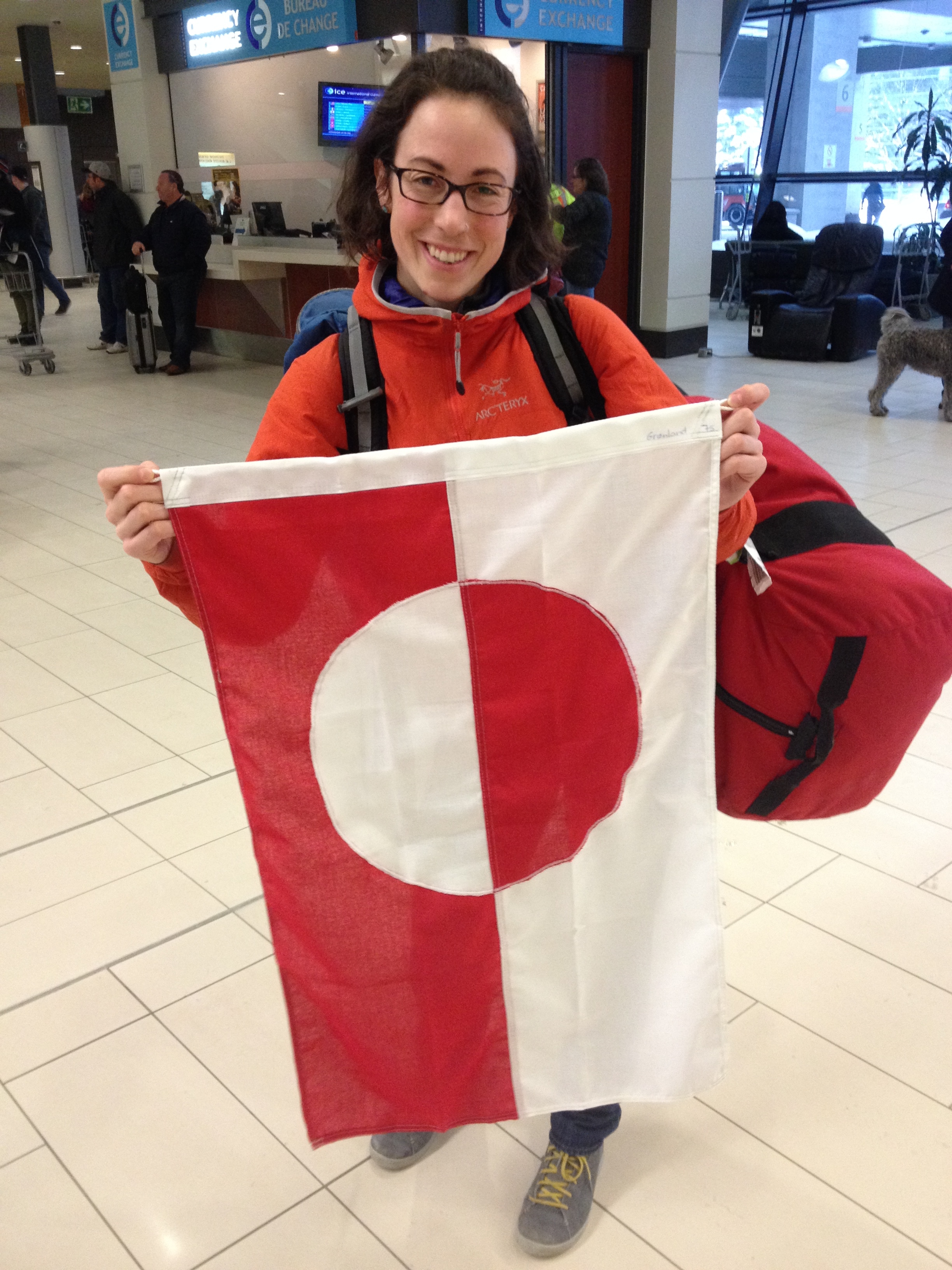 Carleton M.Sc. student Jill Rajewicz holds up the Greenland flag upon our return home to Ottawa.