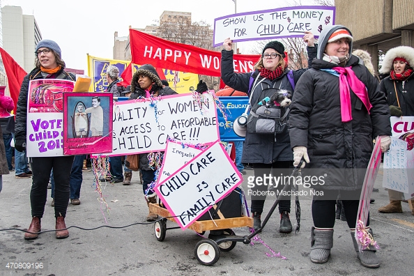TORONTO, ONTARIO, CANADA - 2015/03/07: Signs about affordable daycare in Canada during a protest march the International Women's Day in Toronto. Thousands gathered in Toronto on Saturday day to mark International Women’s Day. The main themes of this year’s march were fighting for the rights of aboriginal women and raising awareness about sexual violence and racial discrimination. (Photo by Roberto Machado Noa/LightRocket via Getty Images)