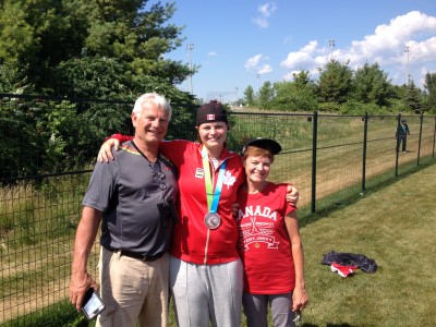 Melissa Armstrong, sporting her silver medal, at the Pan Am Games with parents Chuck and Holly Armstrong.