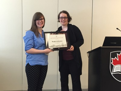 MA candidate Meghan Johnston receiving the award, presented by Prof. Christiane Wilke