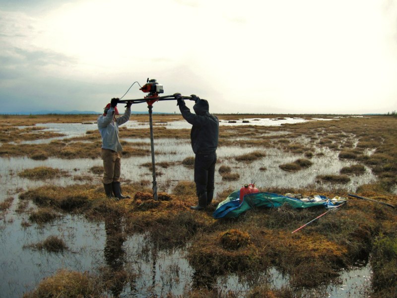 Zoë Braul and Ashlyn Frost extracting a permafrost core from a drained lake basin, Old Crow Flats, YT. (June 2010, Pascale Roy-Léveillée