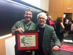 Dr. Robert Coplan, a former student of Dr. Kenneth Rubin's, presents him with the Pickering Award for Outstanding Contribution to Developmental Psychology in Canada