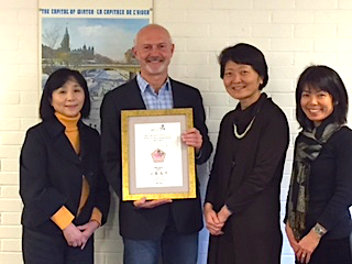 Dr David Wood, Ms. Iwanaga, Yoko Azuma, and Yoriko Aizu holding certificate.