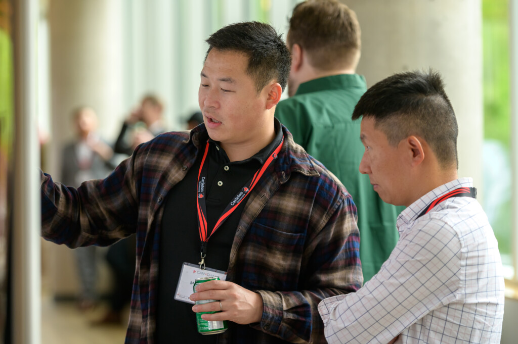 Attendees engaging in poster discussions during CanCH₄ Symposium