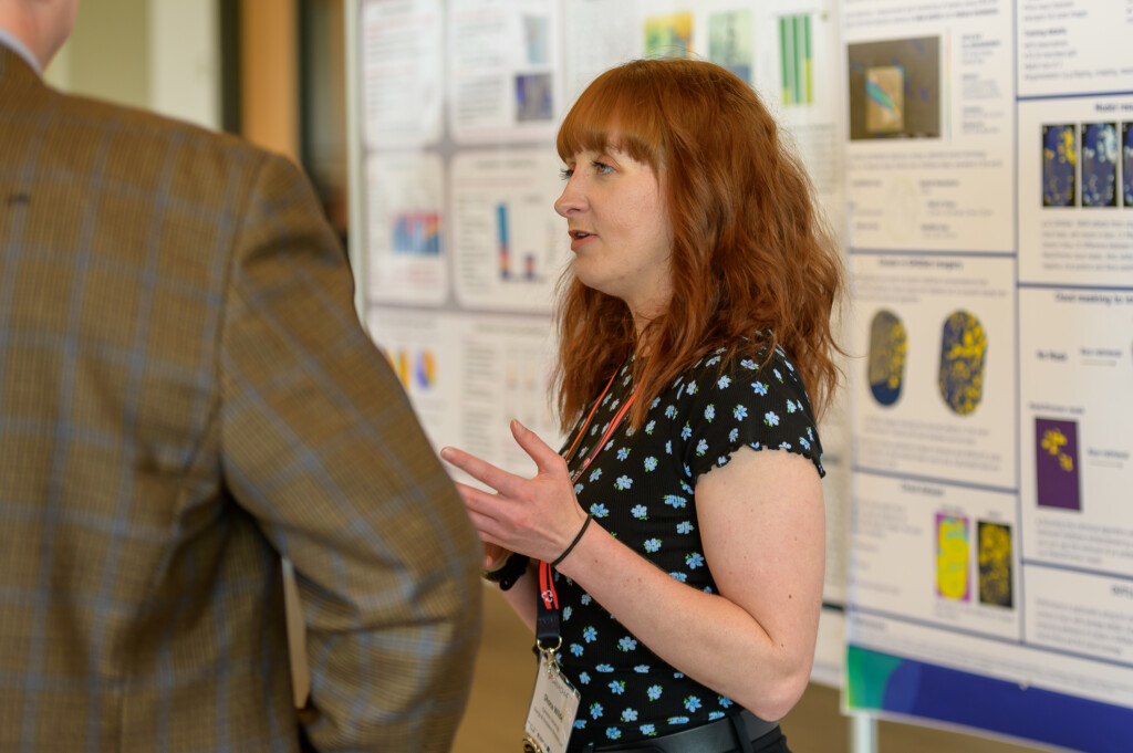 Attendees engaging in poster discussions during CanCH₄ Symposium