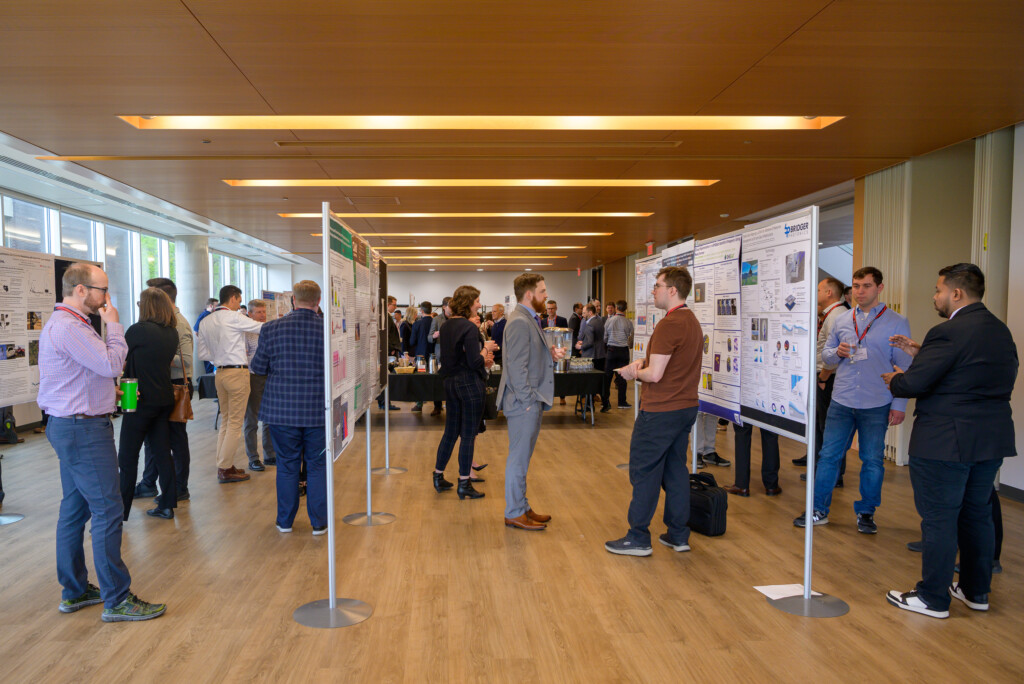 Attendees engaging in poster discussions during CanCH₄ Symposium