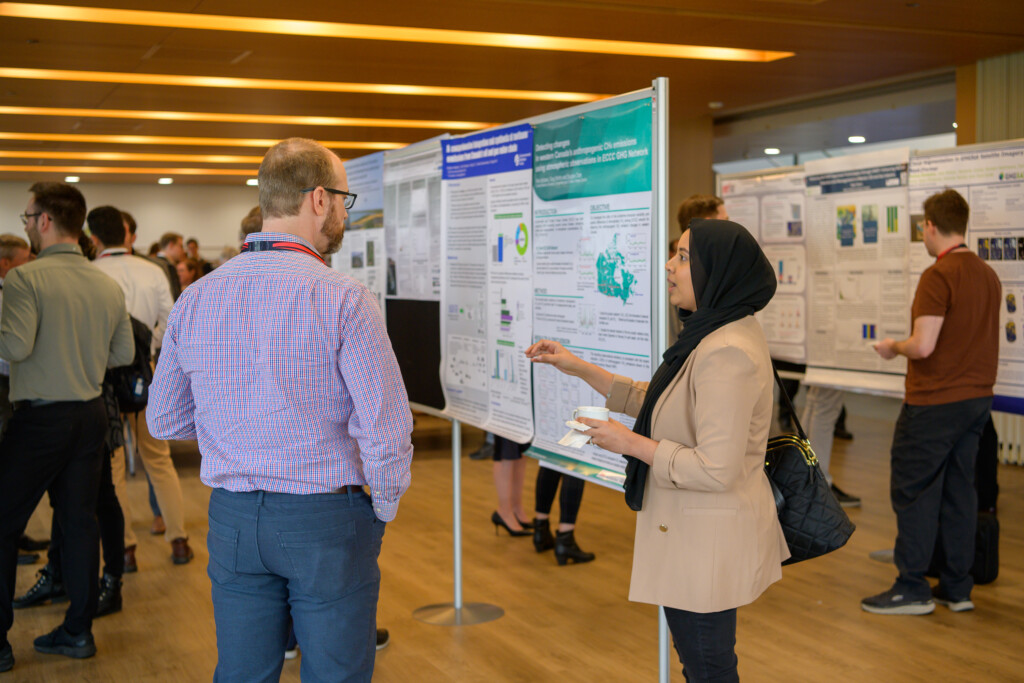 Attendees engaging in poster discussions during CanCH₄ Symposium