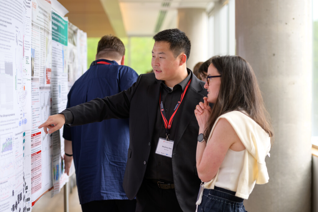 Attendees engaging in poster discussions during CanCH₄ Symposium
