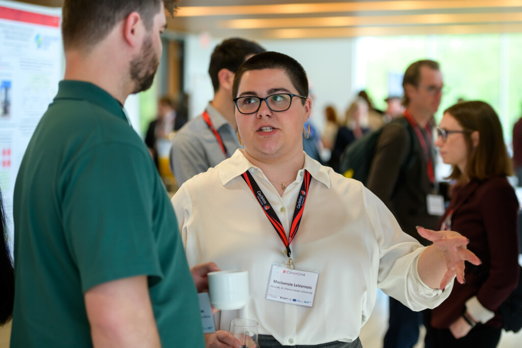 Attendees engaging in poster discussions during CanCH₄ Symposium
