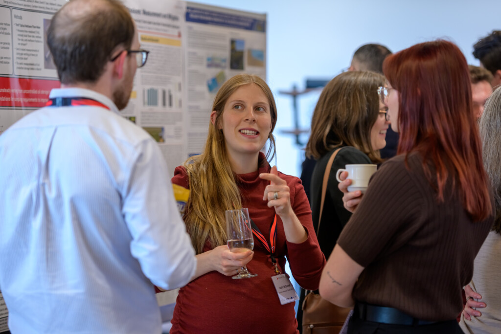 Attendees engaging in poster discussions during CanCH₄ Symposium