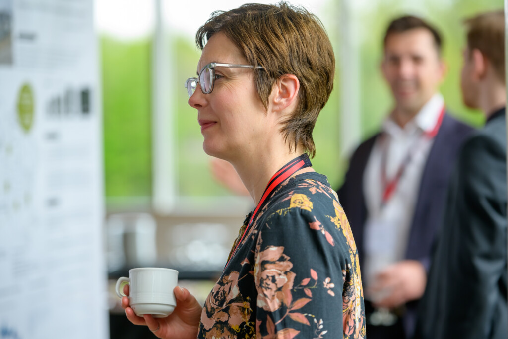 Attendees engaging in poster discussions during CanCH₄ Symposium
