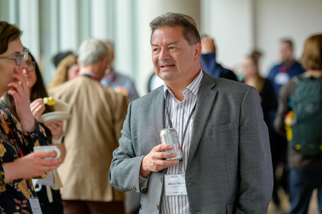 Attendees engaging in poster discussions during CanCH₄ Symposium