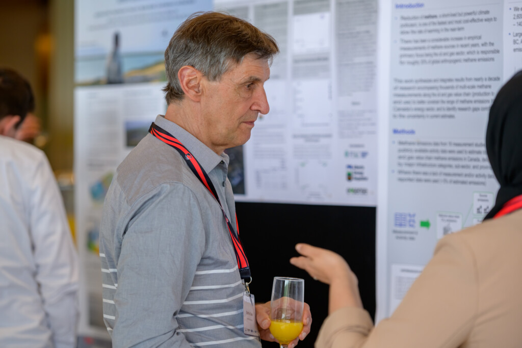 Attendees engaging in poster discussions during CanCH₄ Symposium