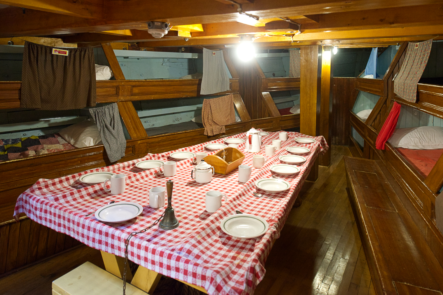 Eating and sleeping quarters inside a fishing schooner.