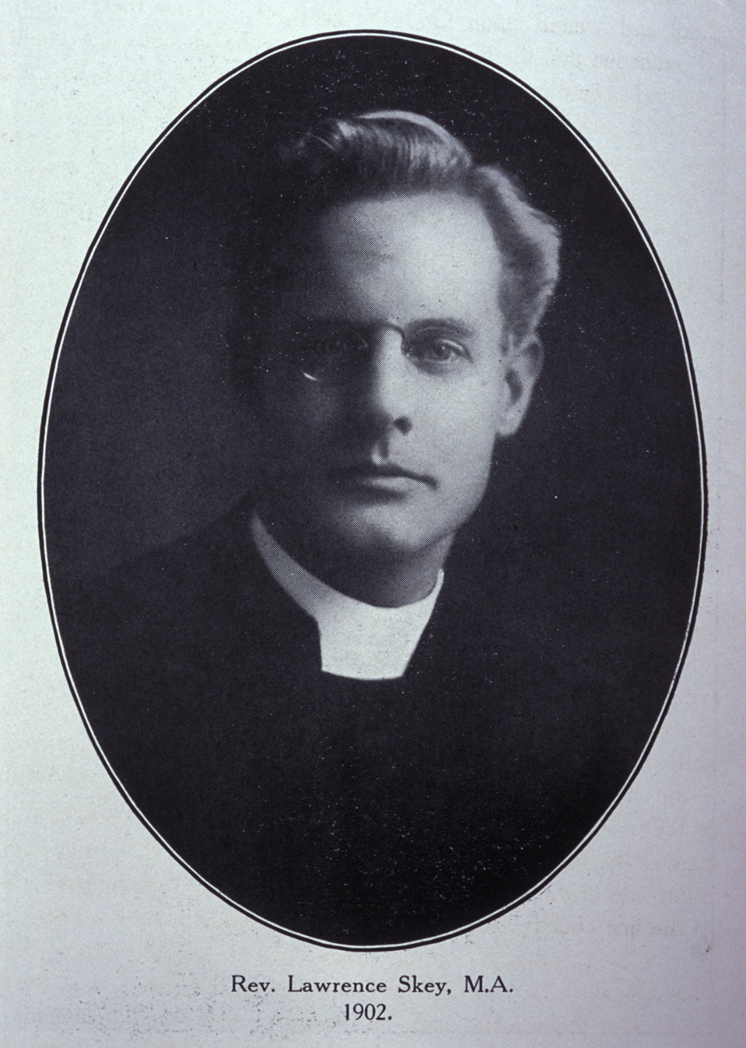 Photographic portrait of a man in clerical robes.