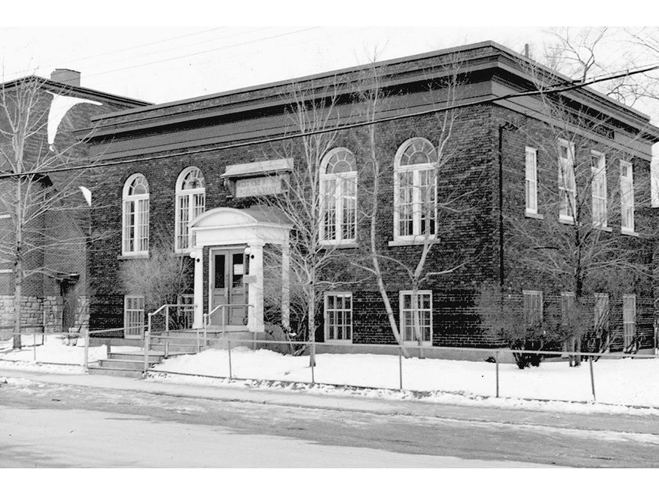 A black & white archival photograph showing the original design of the library facade.