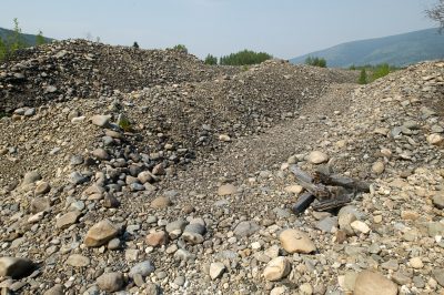 Rows of gravel, barren of animal life or vegetation.