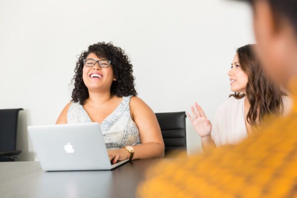 Photo of professionals collaborating over a laptop