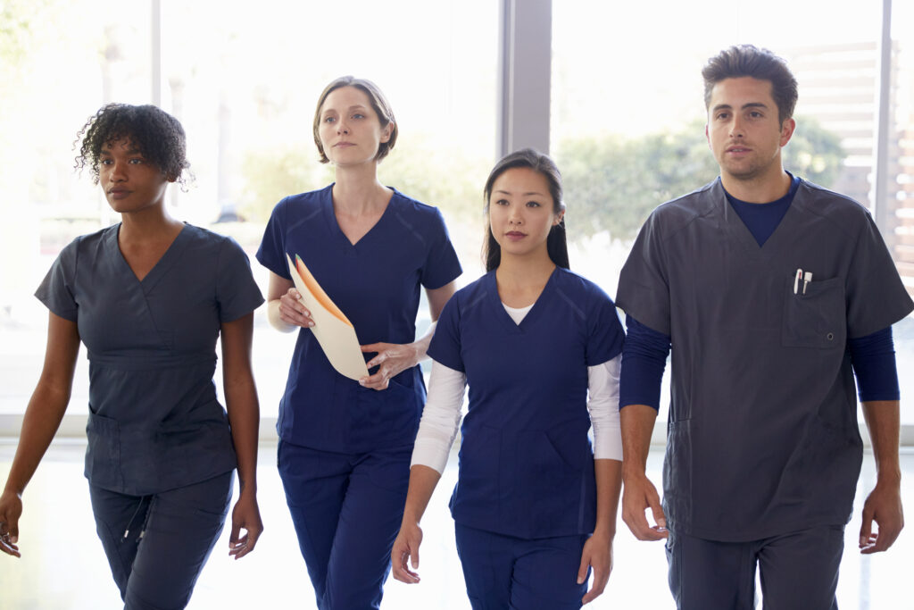 Four nurses walking together