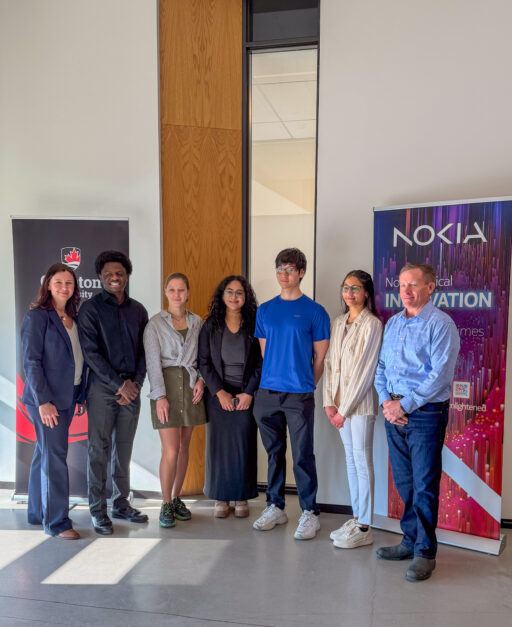 Representatives from Carleton University and Nokia Canada post with students at partnership announcement event.