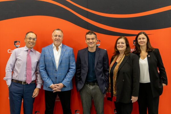 Group photo from the announcement of the Advancement Capital Ice House naming