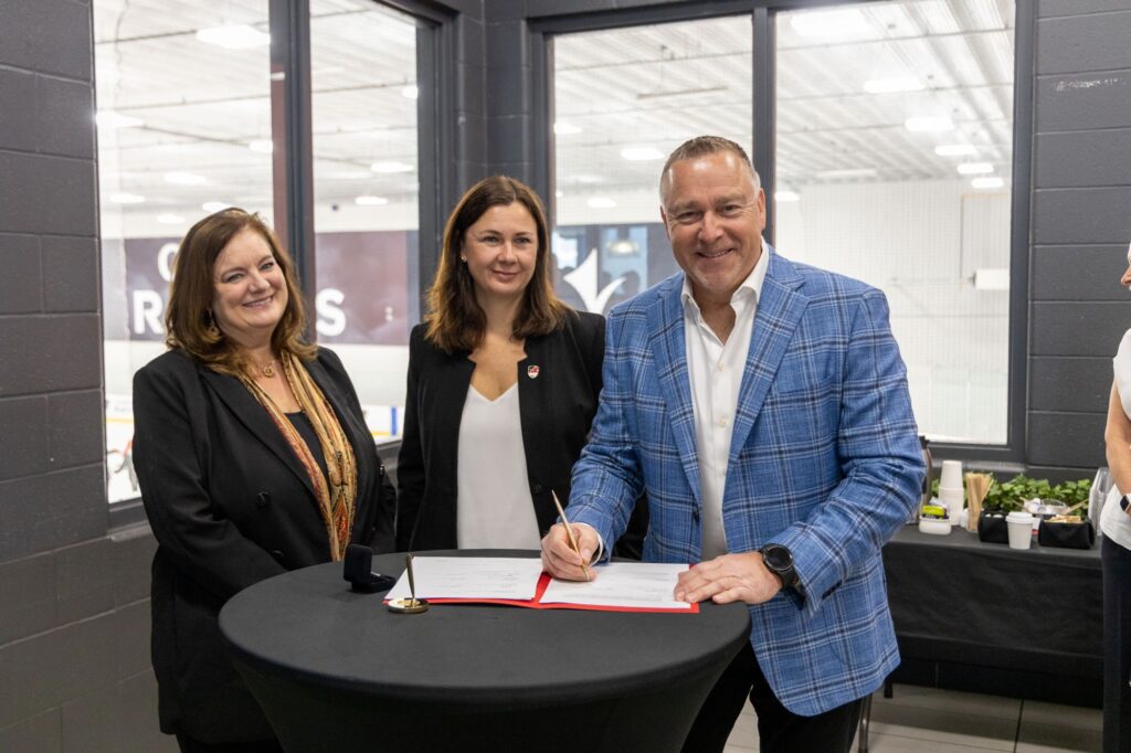 Suzanne Blanchard, Corrie Hobin, and Mike Hapke stand in the Ice House