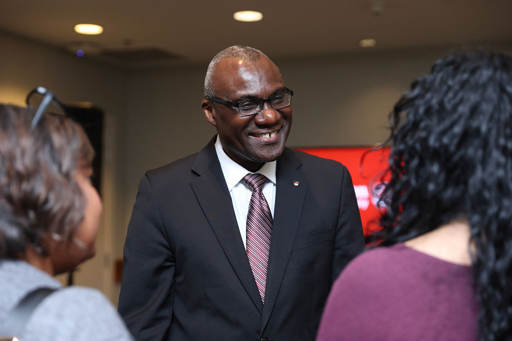 President Wisdom Tettey chats with guests at Carleton's reception in Vancouver on April 23, 2026.