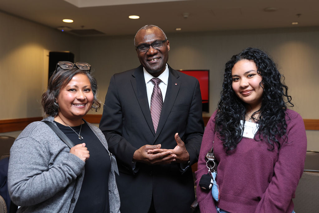 President Wisdom Tettey (centre) with guests at Carleton's reception in Vancouver on April 23, 2026.
