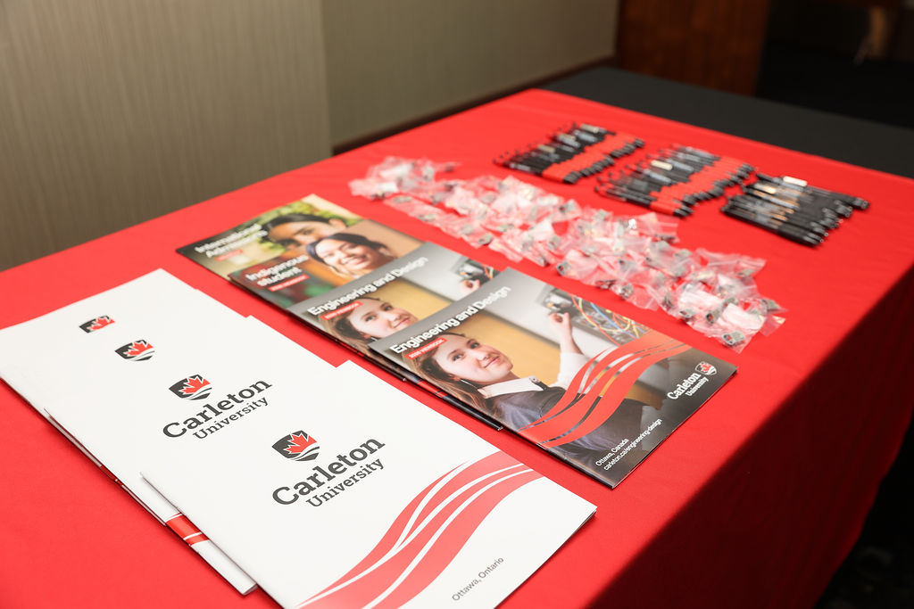Carleton University pamphlets and swag on display at Carleton's reception in Vancouver on April 23, 2026.