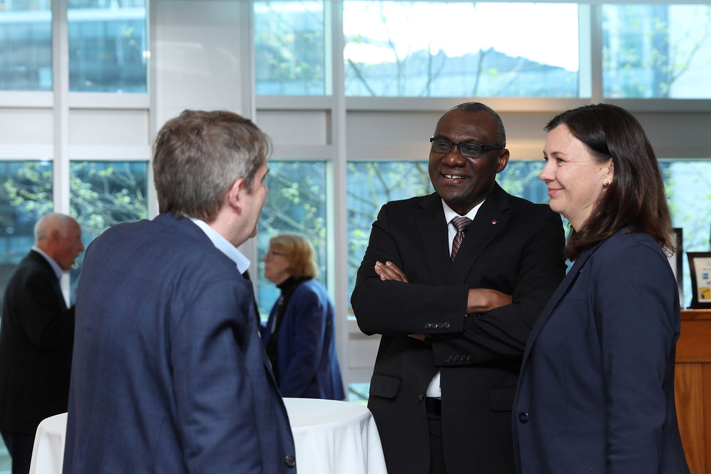 President Tettey (centre) and Corrie Hobin (right) chat with guests at Carleton's reception in Vancouver on April 23, 2026.