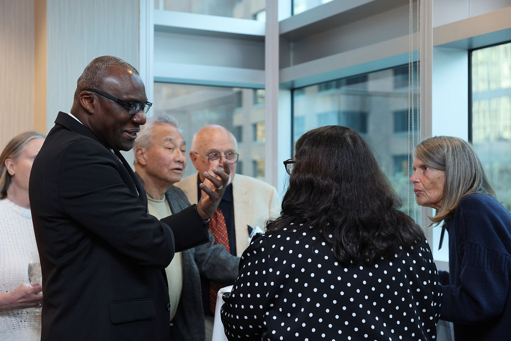 President Wisdom Tettey chats with guests at Carleton's reception in Vancouver on April 23, 2026.