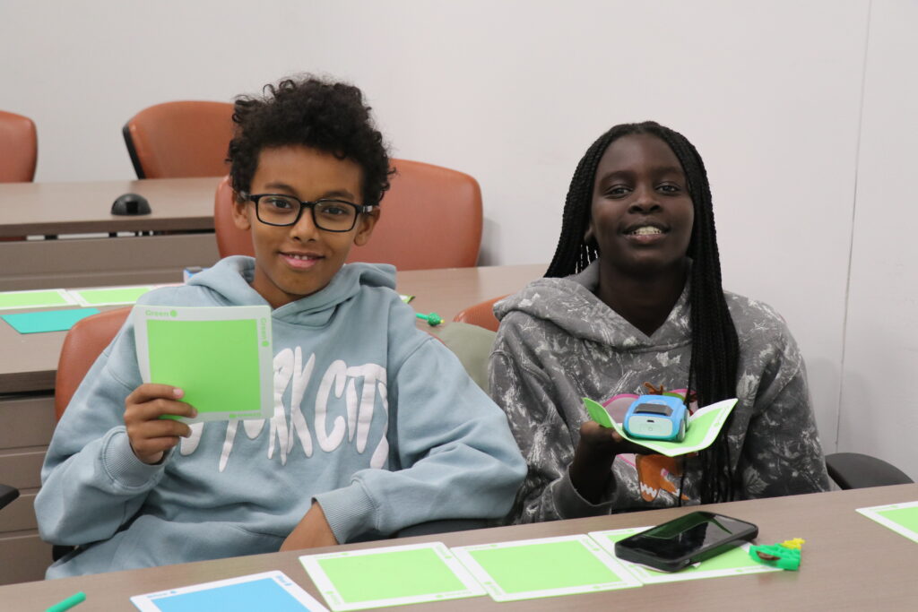 Two Linked> Program participants smiling
