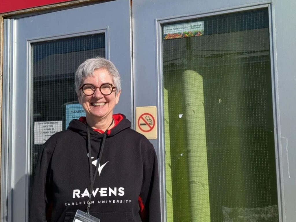 Linda Cruz smiles in a Ravens sweater