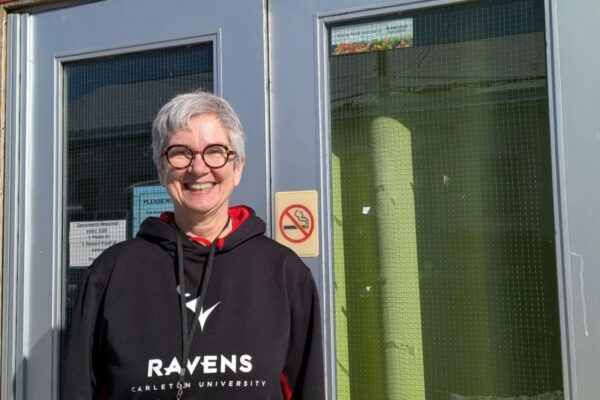 Linda Cruz smiles in a Ravens sweater