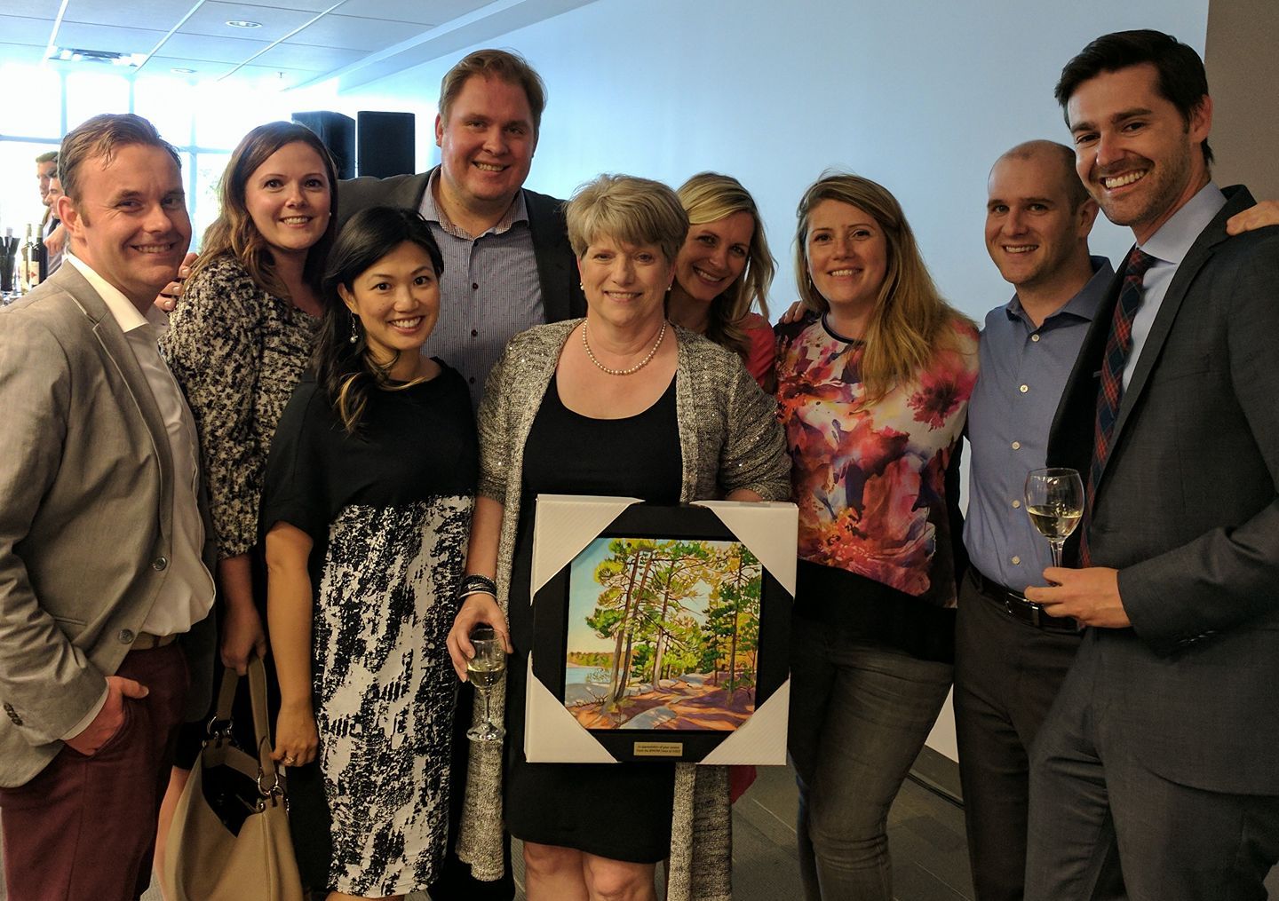 Elaine Rouleau accepts a gift from the BPAPM Class of 2003 at her retirement party