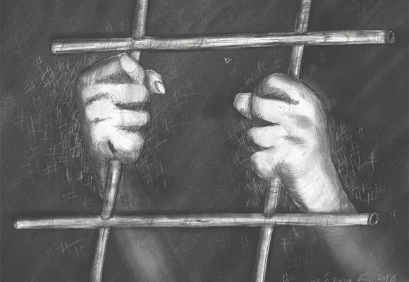 Hands behind bar that resembles 