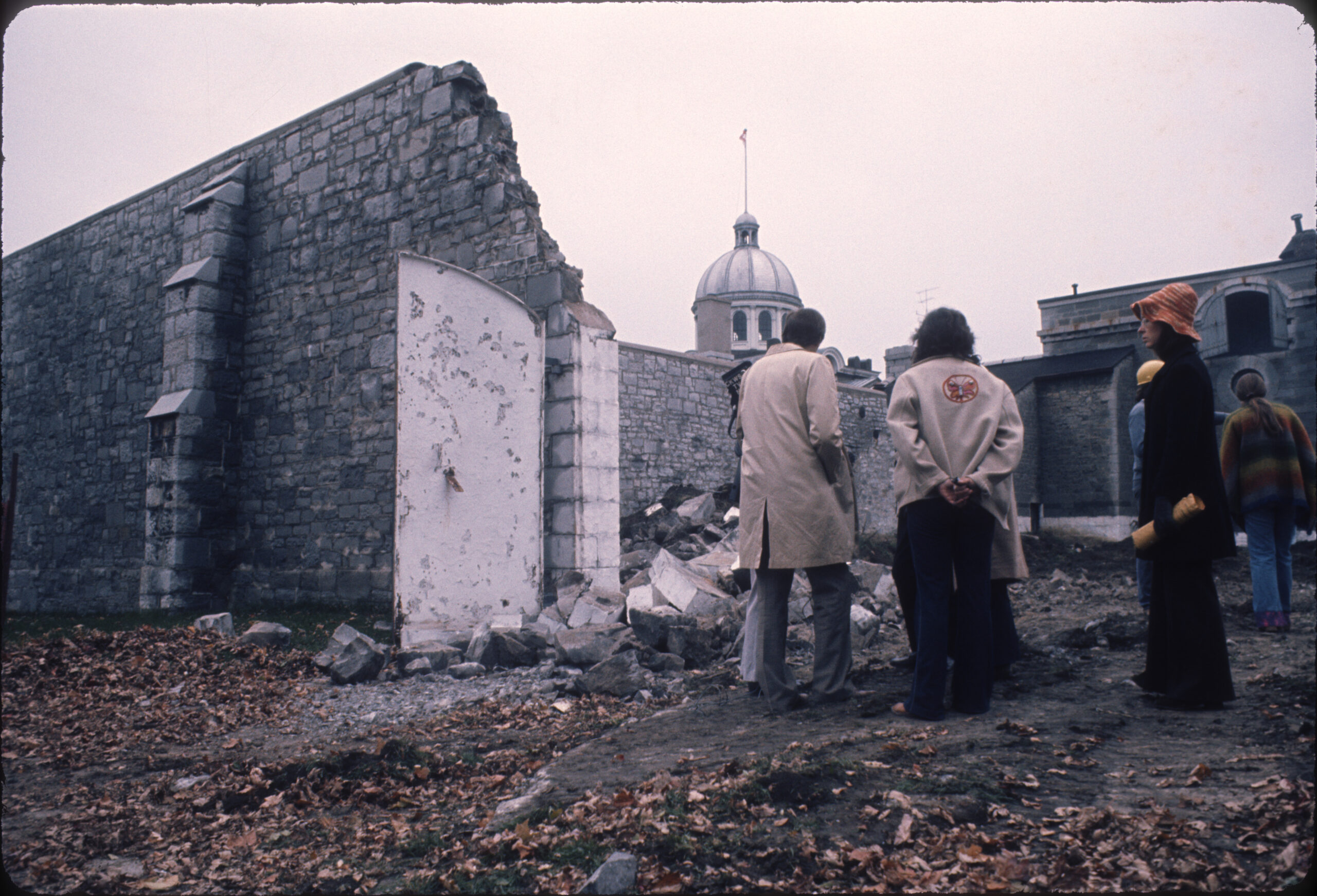 A photo of Professor Pierre du Prey and Queen’s University students standing in protest to save the 19th Century Frontenac County Jail in Kingston, Ontario (demolished in 1973).