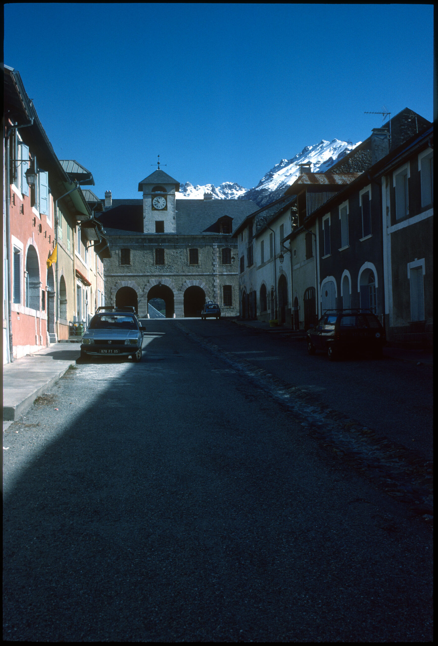 Image of french town square in light and shadow.