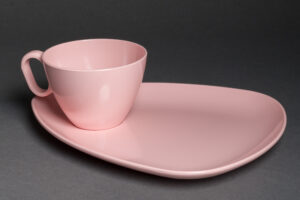 “RPL 'Stylized Dinnerware' Melmac Cup and Triangular Saucer Set (pink)).” Photographed by Etienne Capacchione, 2025