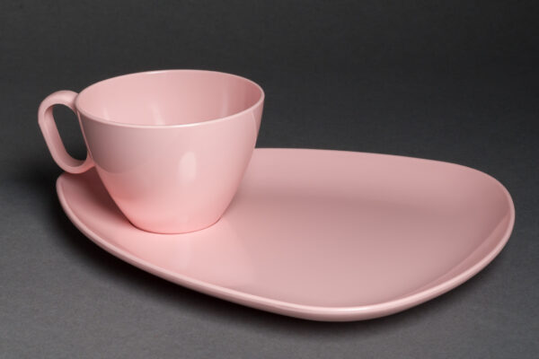 “RPL 'Stylized Dinnerware' Melmac Cup and Triangular Saucer Set (pink)).” Photographed by Etienne Capacchione, 2025