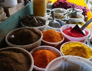 Colourful spices in bowls at a market
