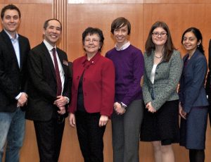 Caption: Supreme Court Justice Louise Charron with some of her former law clerks. Left to right: Palma Paciocco, Kirk Shannon, Graham Mayeda, Justice Louise Charron, Jena McGill, Vanessa MacDonnell, Parul Shah (B.Hum. 2002), and Kyle Kirkup (B.Hum. 2006).