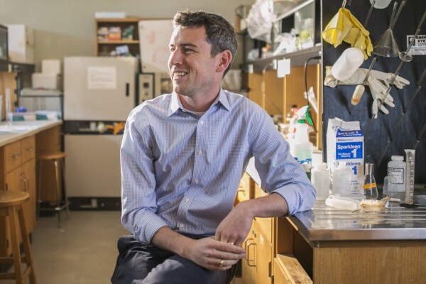 picture of award recipient sitting in a lab