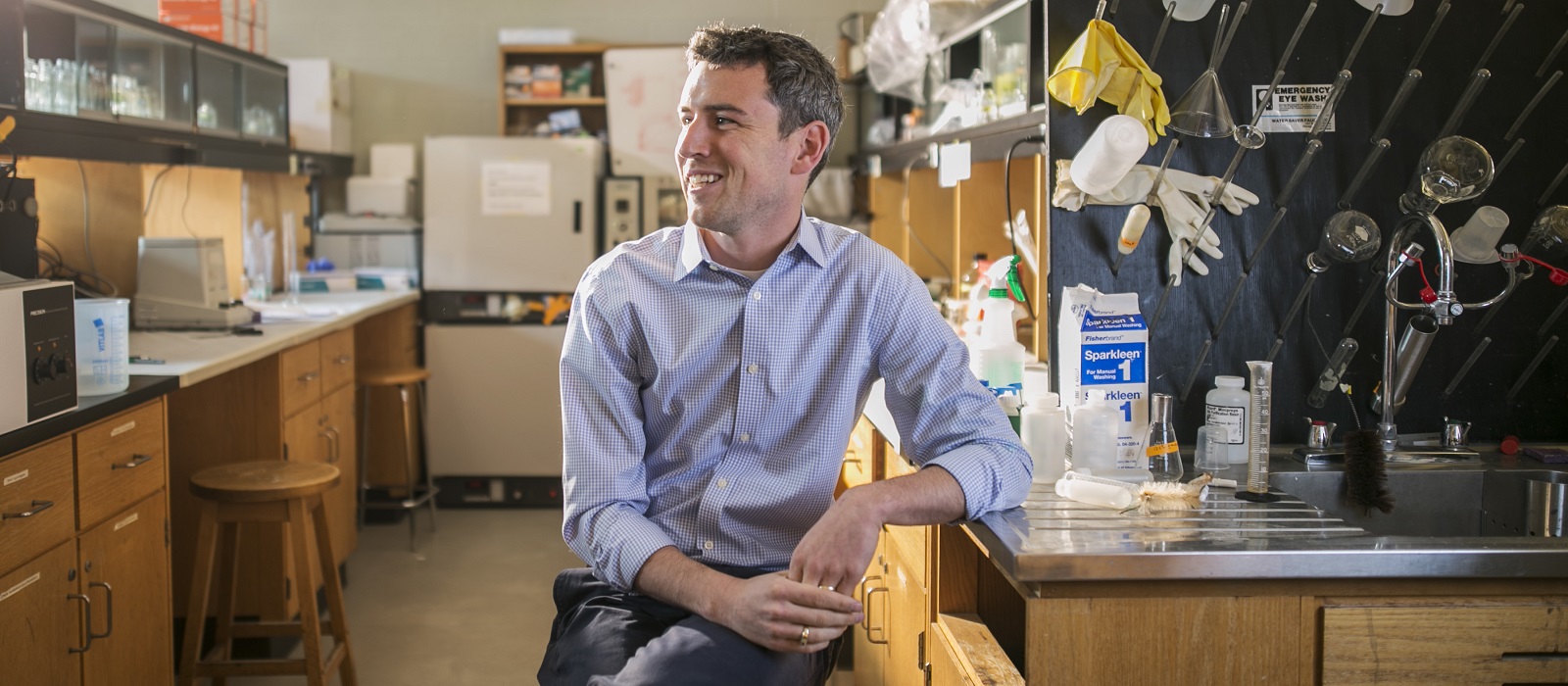 picture of award recipient sitting in a lab