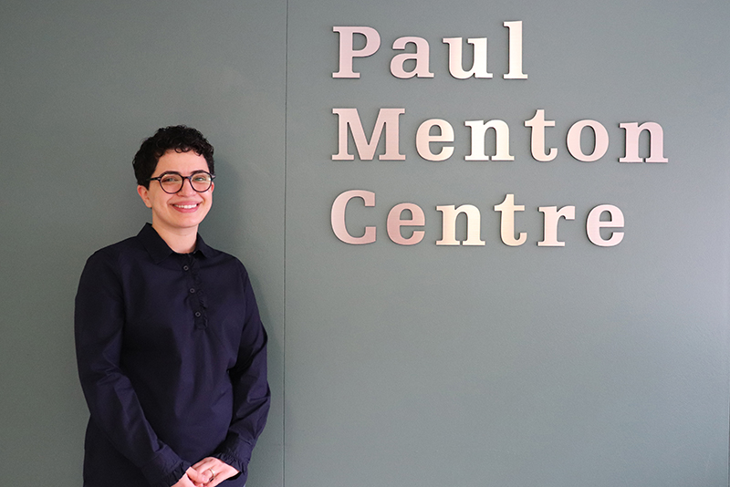 Frohan Foroutan, the 2019 Board Award Recipient standing in front to the Paul Menton Centre for Students with Disabilities.
