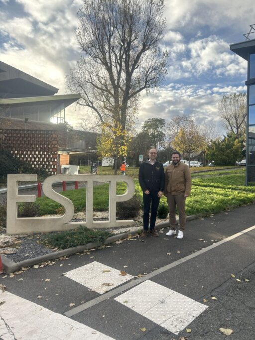 Image shows Dr. Elie Azar beside his host, Dr. Mohammed-Hichem BENZAAMA standing next to the ESTP sign